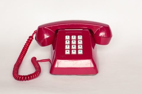 1980s retro telephone in red.