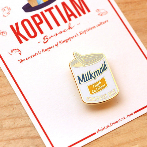 The familiar Milkmaid Condensed Milk brooch shown here pays tribute to our alternative to milk for coffee (that's Kopi for you), and our unhealthy, yet oh-so-delicious replacement for butter to bread.