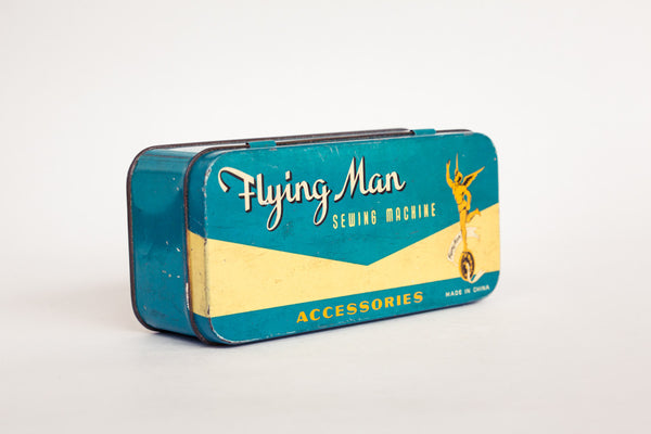 Flying Man Sewing Tin.